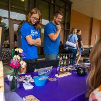 Families looking at booths during Student Small Business Market.